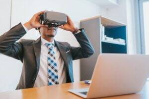 Insights 1 Businessman using virtual reality glasses.