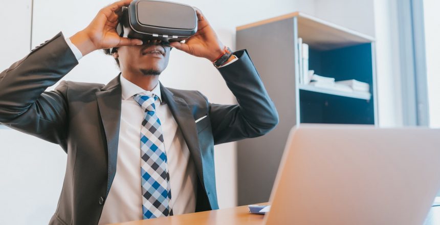 Businessman using virtual reality glasses.